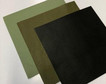 May include: Three fabric swatches in different shades of green and black. The swatches are arranged in a stack, with the lightest green on top and the black on the bottom.