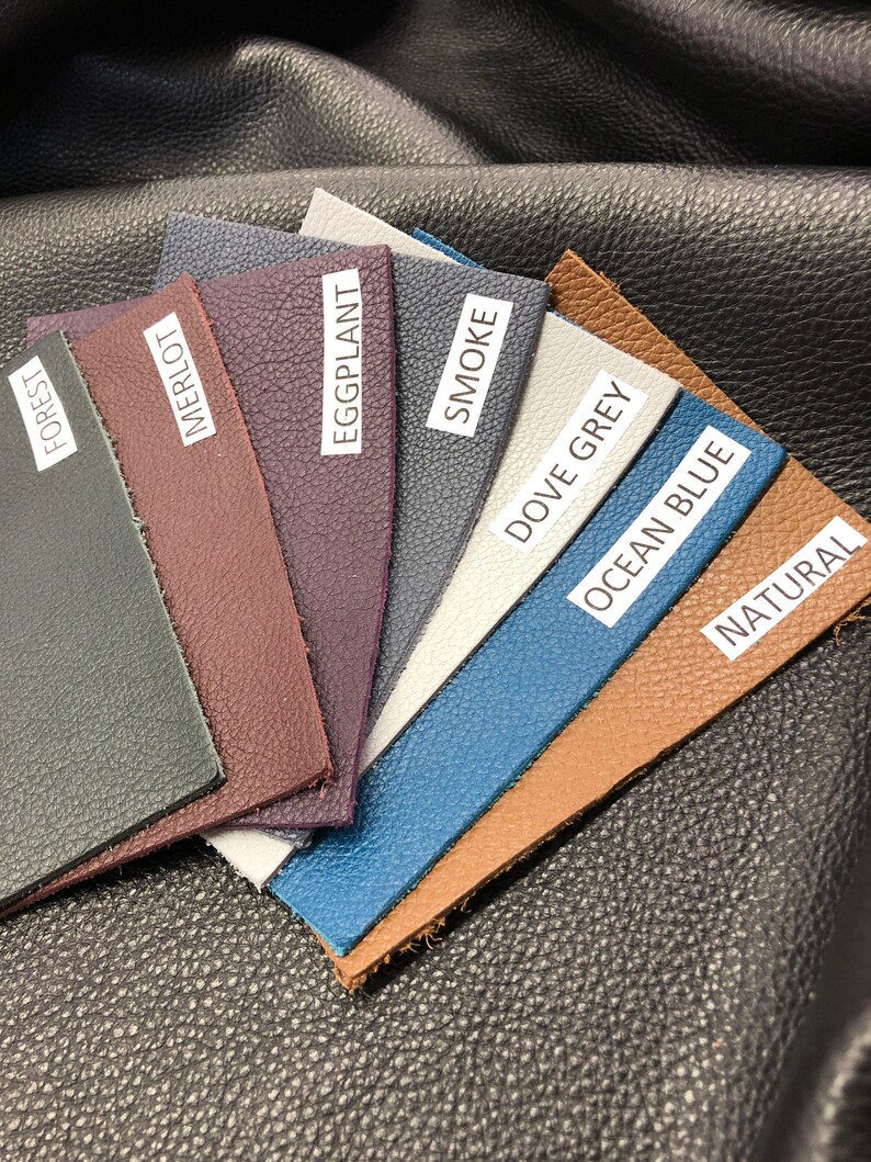 May include: Leather swatches in various colors, including forest, merlot, eggplant, smoke, dove grey, ocean blue, and natural.