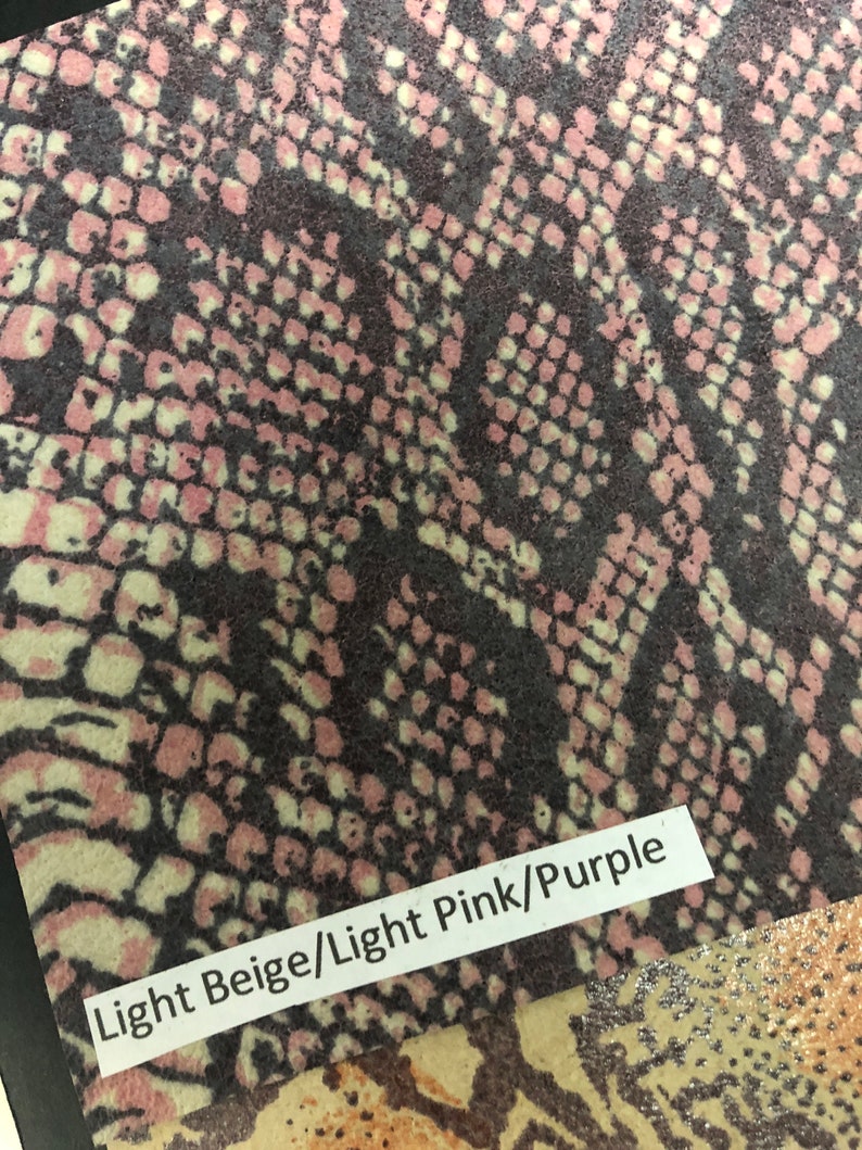 May include: Close-up of a fabric swatch with a snakeskin pattern in light beige, light pink, and purple. The text "Light Beige/Light Pink/Purple" is printed on the fabric.