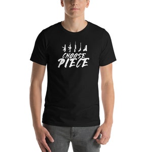 May include: Black t-shirt with a white graphic of guns and the text "Choose Piece".