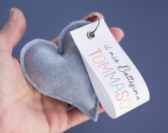 Heart-shaped favor or placeholder, complete with confetti, for a birth or baptism