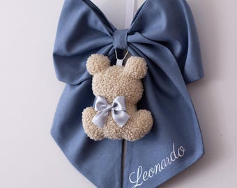 Baby boy's birth bow in blue cotton with a teddy bear