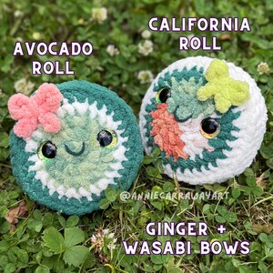 May include: Two plush sushi rolls: an avocado roll with a pink bow and a California roll with a green wasabi bow. Both have smiling faces and large, glittery eyes. Text reads "Avocado Roll", "California Roll", and "Ginger + Wasabi Bows".