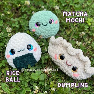 May include: Three crocheted food plushies: a green Matcha Mochi, a white Rice Ball with seaweed, and a beige Dumpling. Each has embroidered eyes, rosy cheeks, and a smiling mouth. The text "Matcha Mochi", "Rice Ball", and "Dumpling" are displayed.