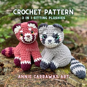 May include: Two crocheted plush toys: a red panda and a raccoon. The red panda is mainly red with white and burgundy details. The raccoon is grey with black and white markings. The text "CROCHET PATTERN 3 IN 1 SITTING PLUSHIES" is at the top, and "ANNIE CARRAWAY ART" is at the bottom.