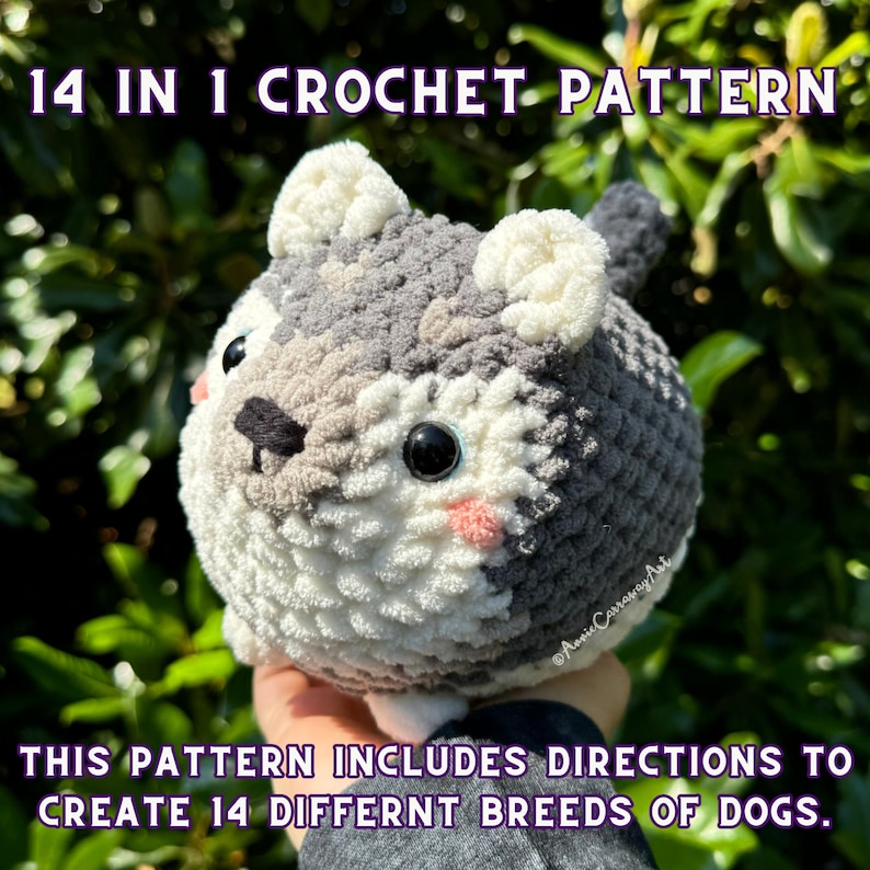 May include: A crocheted dog pattern with the text "14 IN 1 CROCHET PATTERN." The plush dog is gray, white, and black, with pink cheeks and large black eyes. The pattern includes directions to create 14 different dog breeds.
