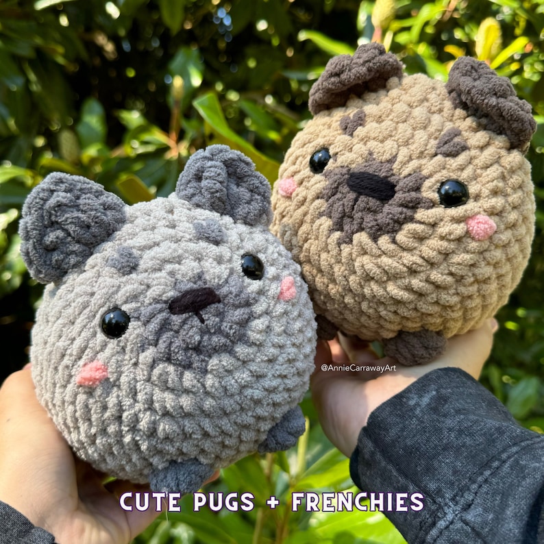 May include: Two handmade crochet pug dog plushies. One is gray, the other is tan. Both have black eyes, pink cheeks, and dark brown noses. The text "CUTE PUGS + FRENCHIES" is at the bottom of the image.