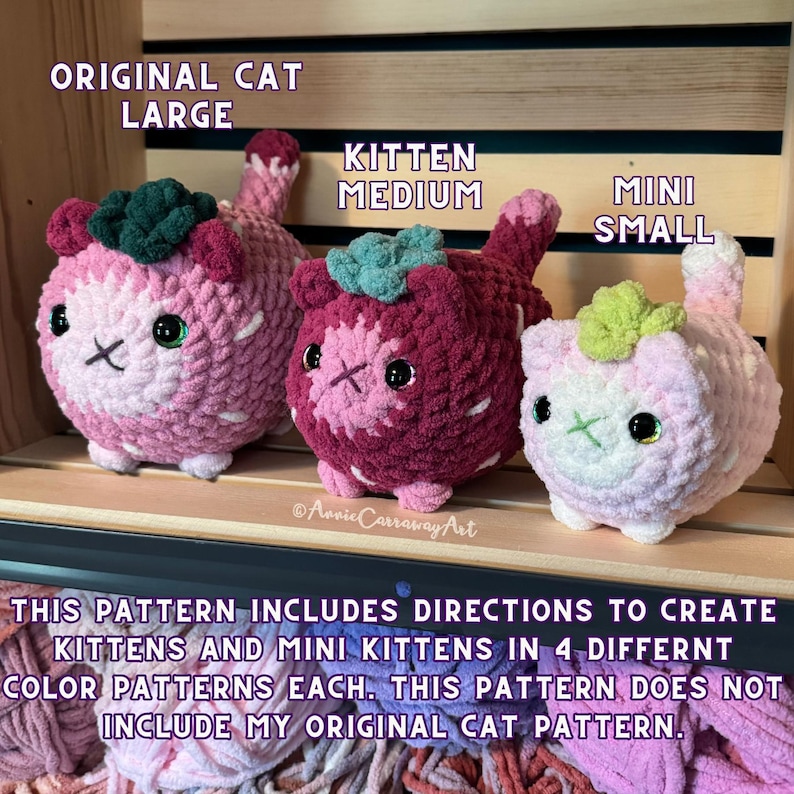 May include: Three crocheted cat toys in varying sizes and colors. The largest is pink and white, the medium is burgundy and pink, and the smallest is light pink. Each has a green leaf-like detail on its head and embroidered facial features. Text on the image reads "ORIGINAL CAT LARGE", "KITTEN MEDIUM", and "MINI SMALL".