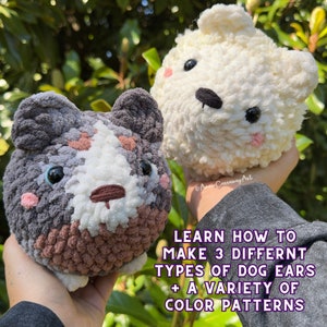 May include: Two handmade crochet dog-shaped plushies. One is gray, white, and brown, the other is white. Both have black eyes and pink cheeks. The image includes text that reads: "LEARN HOW TO MAKE 3 DIFFERENT TYPES OF DOG EARS + A VARIETY OF COLOR PATTERNS."