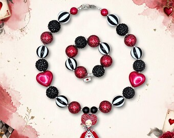 May include: A beaded necklace and bracelet set featuring red, black, and white striped beads, black glitter beads, and red glitter beads. The necklace includes two red heart-shaped beads and a central pendant of a queen character in a red dress.