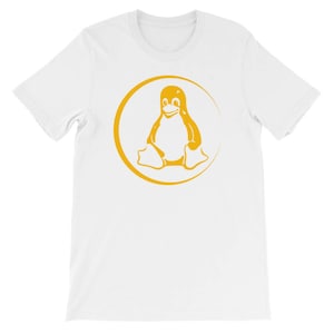 May include: White t-shirt featuring a yellow circle with a penguin inside. The penguin is sitting down with its wings outstretched and has a smile on its face.