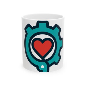 May include: A white ceramic mug featuring a graphic design of a teal gear with a thick dark blue outline. Centered within the gear is a solid red heart shape. The design is clean and bold, positioned on the front of the cylindrical mug body.