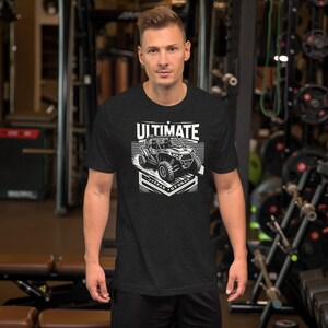 May include: Black t-shirt with a white graphic of an off-road vehicle. The graphic says "Ultimate Off-Road".