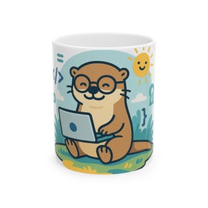 May include: A white ceramic mug featuring a cartoon illustration of a brown otter wearing round glasses and typing on a laptop. The background includes a yellow sun, green grass, and blue coding symbols like brackets and an equals sign.