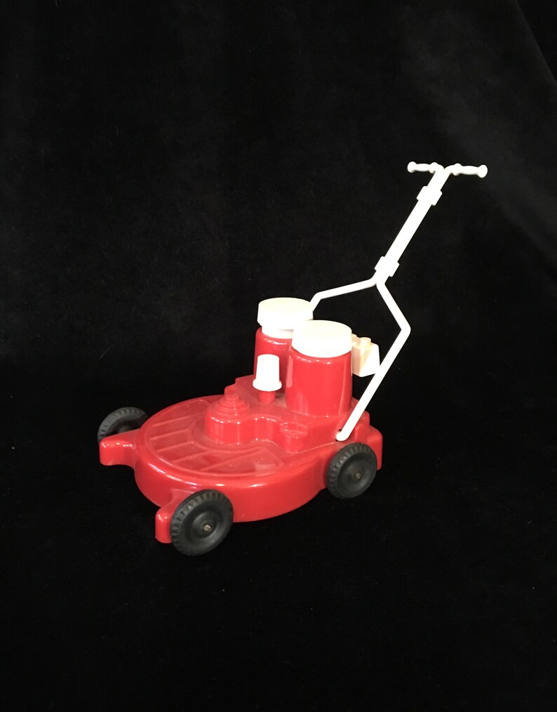 tiny toy lawn mower