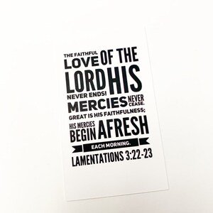 May include: Black and white typography print with the text "The faithful love of the Lord His mercies never ends! Great is His faithfulness; His mercies begin afresh each morning. Lamentations 3:22-23"