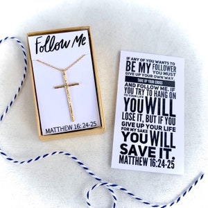 May include: Gold cross necklace in a box with a card that reads "If any of you wants to be my follower you must give up your own way. Take up your cross and follow me. If you try to hang on to your life you will lose it, but if you give up your life for my sake you will save it. Matthew 16:24-25"