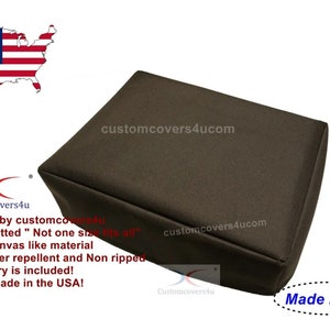 May include: A brown custom-fitted cover for a piece of furniture. The cover is made of a strong canvas-like material and is water repellent. The text "Custom Fitted" and "Not one size fits all" is printed on the cover. The text "Made in USA" is printed on a white oval sticker.