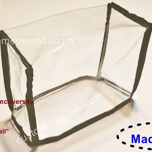 May include: A clear vinyl cover with black nylon trim, designed to protect an item. The cover is custom-made and features the text "Made in USA". The design is by customcovers4u.