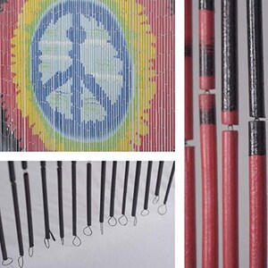 May include: A colorful bamboo beaded curtain with a peace sign design. The curtain features a rainbow of colors, including red, yellow, blue, and green. The peace sign is in the center, with a blue background. The curtain is made of bamboo beads.