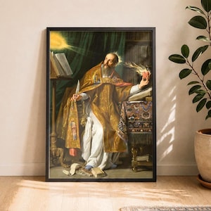 Könnte beinhalten: Ein gerahmter Kunstdruck, der eine bärtige Figur in prunkvollen goldenen und weißen geistlichen Gewändern zeigt, die ein brennendes Herz in der einen und eine Feder in der anderen Hand hält, sitzend an einem Schreibtisch mit offenen Büchern.