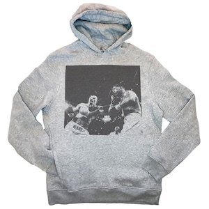 May include: Gray hooded sweatshirt with a black and white graphic print of two boxers in a ring. The text "WARD" is visible on the boxer's shorts.