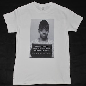 Lisa &#39;Left Eye&#39; Lopez TLC mugshot White T-shirt sizes available S-3XL