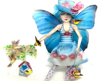 Jewelry with fairy/butterfly doll, paper and plastic articulated, a small puppet to play. This cute girl has a birdhouse for little birds.