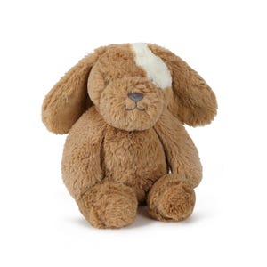 May include: A plush brown puppy dog with floppy ears and a white patch on its head. The stuffed animal has a soft, textured appearance and a gray embroidered nose and mouth. The dog is sitting upright, with its paws visible.