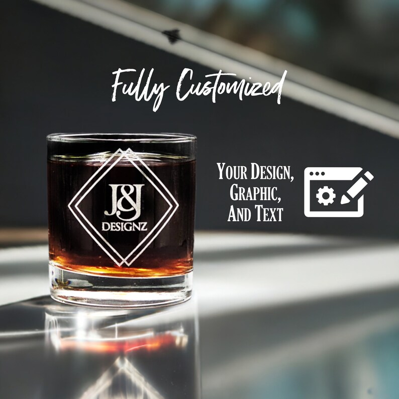 Customized 11 oz Libbey heavy base rocks glass with intricate etched logo and text design, showcasing personalization options for corporate branding or individual style on a reflective surface.