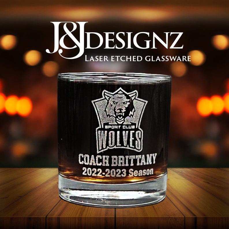 Custom laser-etched 11oz rocks glass with a heavy base and sports logo with coach name. Perfect for recognition, trophy or appreciation gift.