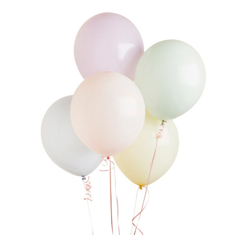 May include: A cluster of six pastel-colored balloons. The balloons are in shades of pink, green, yellow, and white. Each balloon is round and inflated, with ribbons and curly strings attached. The balloons are against a white background.