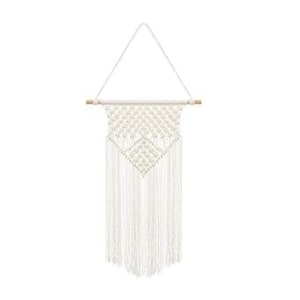 May include: A cream-colored macrame wall hanging with a geometric design and fringe. The wall decor is suspended from a natural wooden dowel and a white cord for hanging. This handcrafted piece adds a bohemian touch to any space.