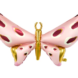 May include: A pink and gold foil butterfly balloon with a burgundy polka dot pattern.