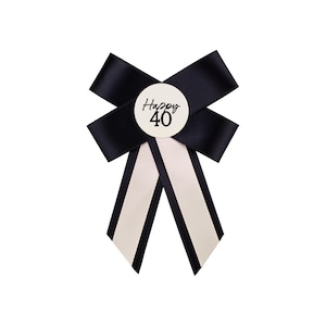 May include: Black and white bow with a white circle that says "Happy 40" in black text.
