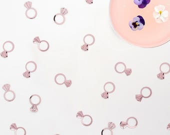 Rose gold diamond ring confetti for a chic bachelorette party, romantic engagement party display