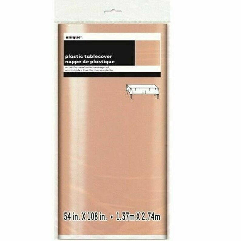 May include: A rose gold plastic table cover with the text "unique" and "plastic tablecover nappe de plastique" in black. The text "reusable washable waterproof" and "r&eacute;utilisable lavable imperm&eacute;able" is also in black. The table cover measures 54 inches by 108 inches or 1.37 meters by 2.74 meters.