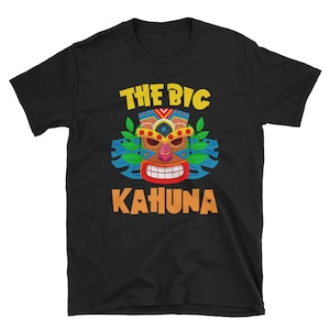 May include: Black t-shirt with a colorful tiki mask graphic and the text "The Big Kahuna" in yellow letters.