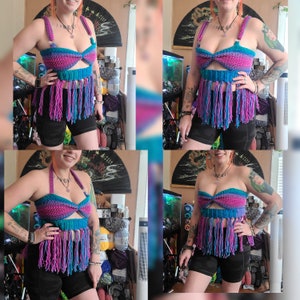 May include: A crocheted top with a fringe trim in shades of pink, purple, and blue. The top has a halter style with a tie closure at the back.