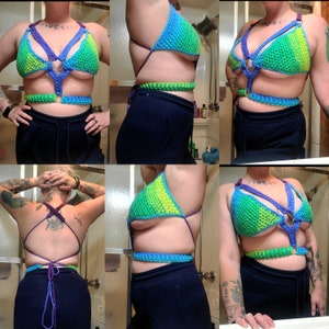 May include: A rainbow crochet top with a halter style and a criss-cross design in the front. The top is made with a variety of colors, including green, blue, and purple.