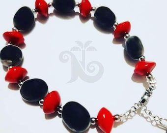 Adjustable bracelet made from natural church and Zanzibar seeds.