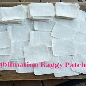 May include: A pile of white fabric squares with frayed edges. The squares are labeled "Sublimation Raggy Patches".