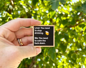 May include: A black wooden sign with white text that reads "Liver: You need to stop drinking. Me: You need to calm the fuck down." The sign has a small graphic of two beer mugs.