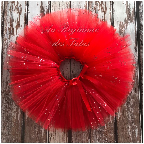 Jupe tutu rouge et paillettes. 3 couches de tulle, ceinture réglable.