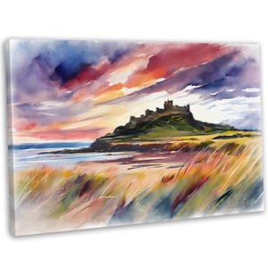May include: A watercolour painting depicting a castle perched on a hill overlooking a sandy beach. The sky is a vibrant blend of pink, orange, and purple, with clouds casting shadows on the water. The castle is a dark silhouette against the bright sky.