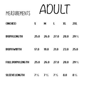 May include: Adult size chart for clothing with measurements in inches for body length, body width, full body length, and sleeve length. Sizes include S, M, L, XL, and 2XL.