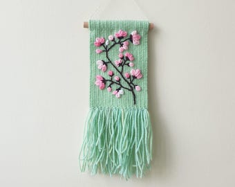 Small woven wall hanging with with embroidered flower. Small tapestry ornament . Gallery wall decoration. Magnolia flower embroidery art.