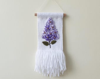 Small woven wall hanging with with embroidered flowers. Small tapestry ornament . Gallery wall decoration. Lilac flower embroidery art.