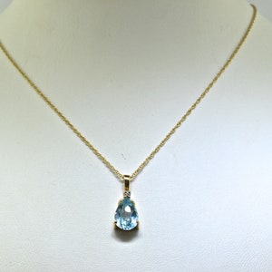 14k Diamond And Blue Topaz Necklace