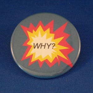 May include: A blue button with a red and yellow starburst design. The starburst has the word "WHY?" in a white speech bubble.